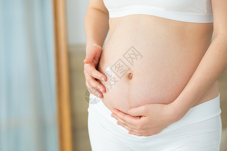 祛妊娠纹孕妇使用乳液护理皮肤背景