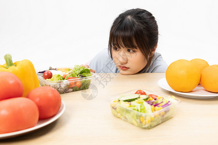 讨厌吃水果蔬菜的女性背景图片