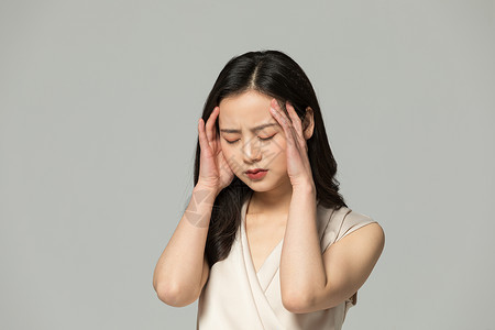 居家女人表现头痛情绪头疼难过的女性背景