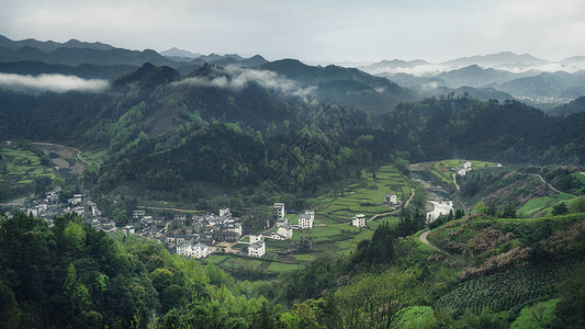 徽州黄山安徽黄山歙县徽州山村清晨云雾缭绕背景