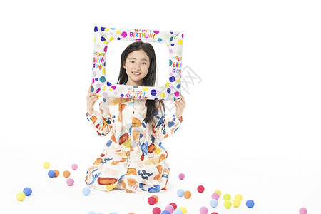 彩色相框拿着生日相框的小女孩背景