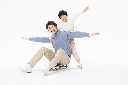 玩滑板男孩元素儿童节父子相伴玩滑板背景