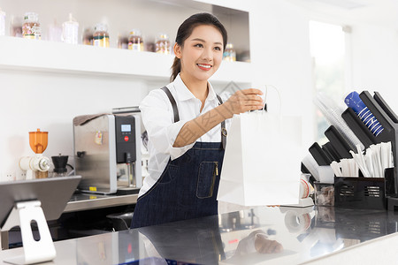 美女素材打包饮品店女性服务员递交外卖袋背景