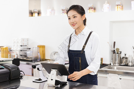 饮品店前台女性服务员背景图片