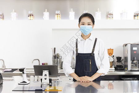 饮品店女性服务员戴口罩服务奶茶店高清图片素材