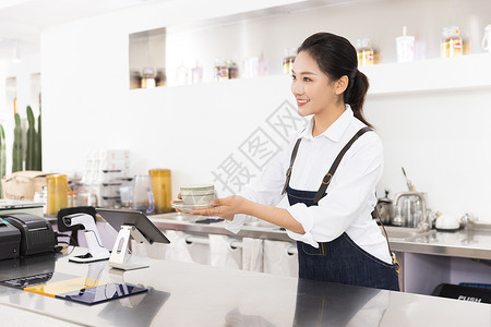 饮品店女性服务员递咖啡背景