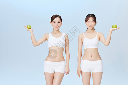 青苹果健康饮食减脂夏日闺蜜手拿青苹果展示背景
