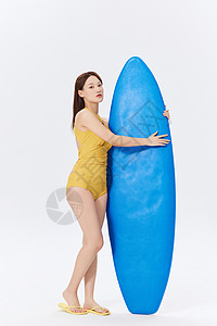 夏日泳装美女形象夏天元气美女手拿冲浪板背景