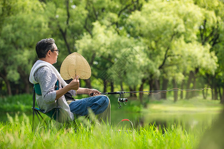 钓叟中年男性户外垂钓乘凉背景