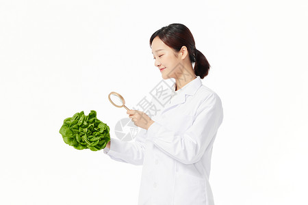 营养学家观察蔬菜背景图片