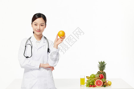 女营养师手拿苹果展示女营养师手拿西柚展示背景