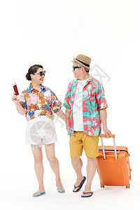 夏威夷旅游牵手旅行的老年夫妻背景