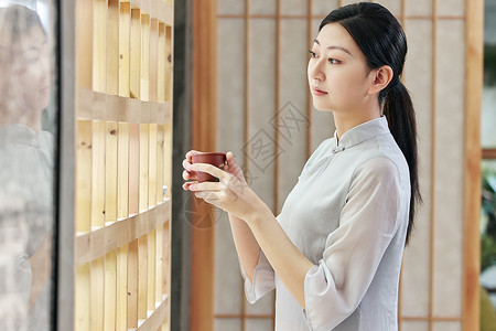 气质美女品茶背景图片