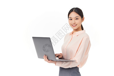 使用笔记本电脑办公的商务女性背景