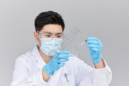 科研产品医疗科研人员使用滴管培养皿做实验背景
