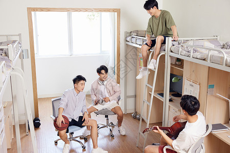 音乐类型男大学生在宿舍的休闲生活背景