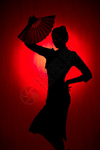 古典红色暗纹拿着扇子的旗袍美女剪影背景