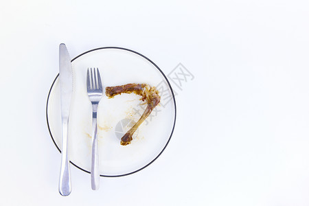 浪费食物节约粮食餐盘里吃剩的骨头背景