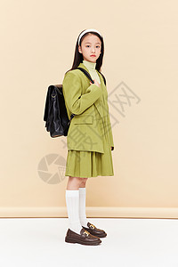 时尚绿西装少女背书包图片