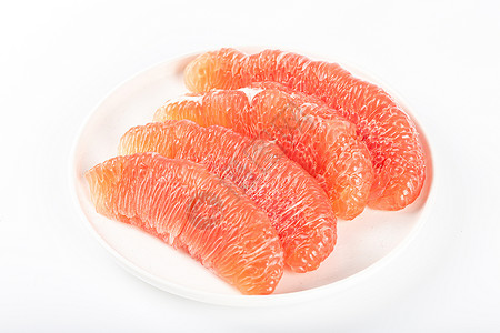 文旦柚白色餐盘里的柚子果肉背景