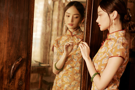 中国风发钗整理妆发的旗袍国风美女背景