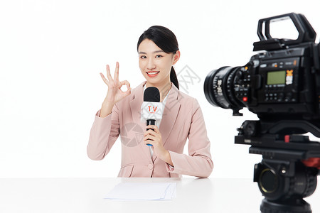 摄像机标志摄像机前的娱乐新闻记者比ok手势背景