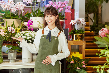 鲜花店美女销售员服务手势图片