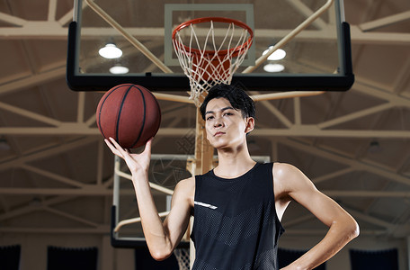 炫酷体育素材篮球运动员手拿篮球转球背景