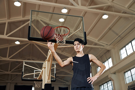 炫酷光效球篮球运动员手拿篮球转球背景