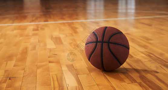 室内篮球场地板上的篮球背景图片