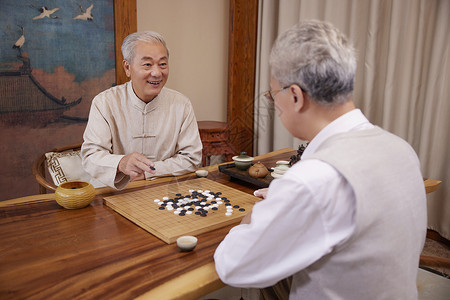 老友聚会下围棋背景图片