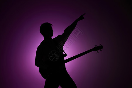 吉他剪影素材弹吉他的男性剪影背景