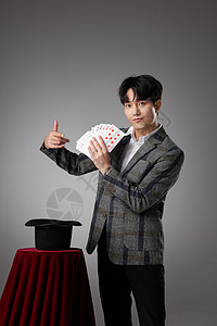 扑克牌魔术魔术师变魔术形象背景