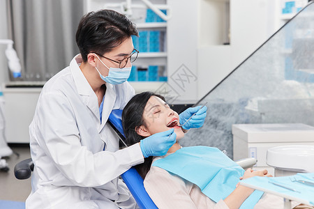 护士接待牙科医生检查牙齿背景