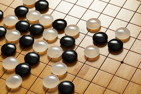 围棋盘上的黑白棋子背景图片