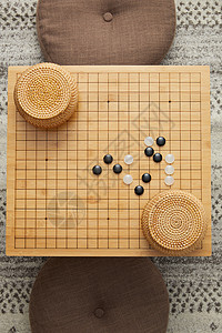 金木素材黑白俯视角围棋盘上的黑白棋子背景