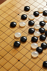 围棋盘上的黑白棋子背景图片