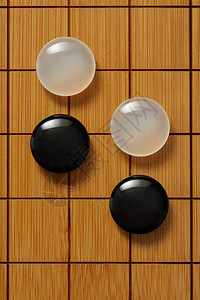 围棋盘上的黑白棋子图片