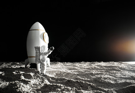 火箭太空月球站在月球表面挥手的宇航员背景