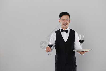 端着红酒的服务生形象图片