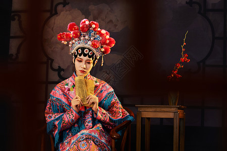 国粹戏曲京剧美女舞台坐着看书图片