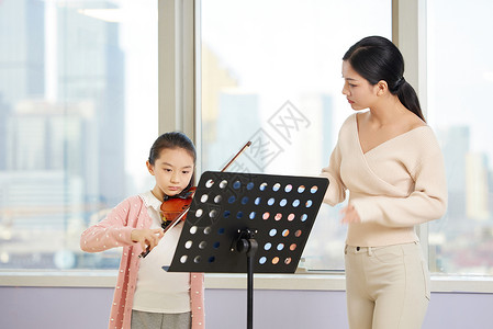 拉小提琴女生音乐老师课外辅导小朋友小提琴背景