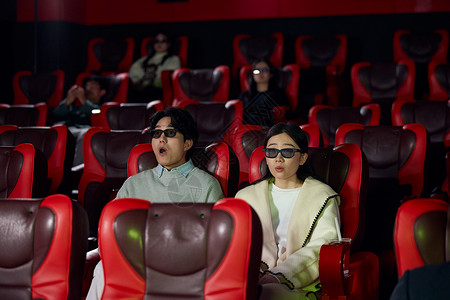两个3D人物青年情侣戴3D眼镜电影院约会背景