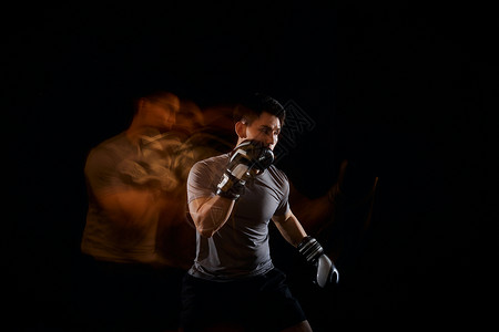 拳击手打拳的男性运动轨迹背景