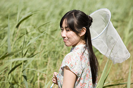 带蝴蝶网的妇女图片