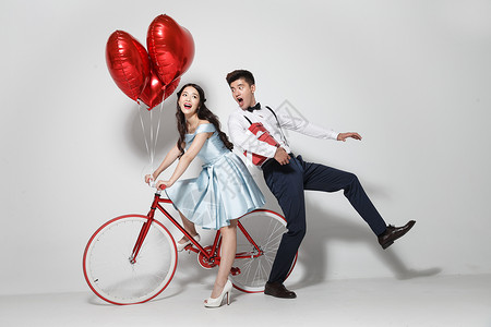 喜事结婚订婚红色青年人浪漫情侣骑自行车背景