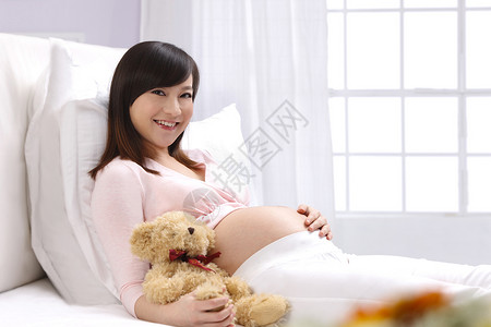 20多岁爱幸福的孕妇背景图片