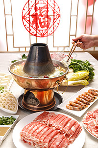 手抓筷子元素金属火锅与食材背景