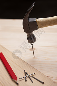 木头制品铁锤子钉钉子背景