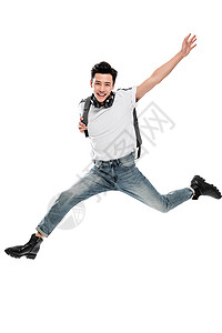 影棚拍摄信心热情快乐跳跃的男青年图片
